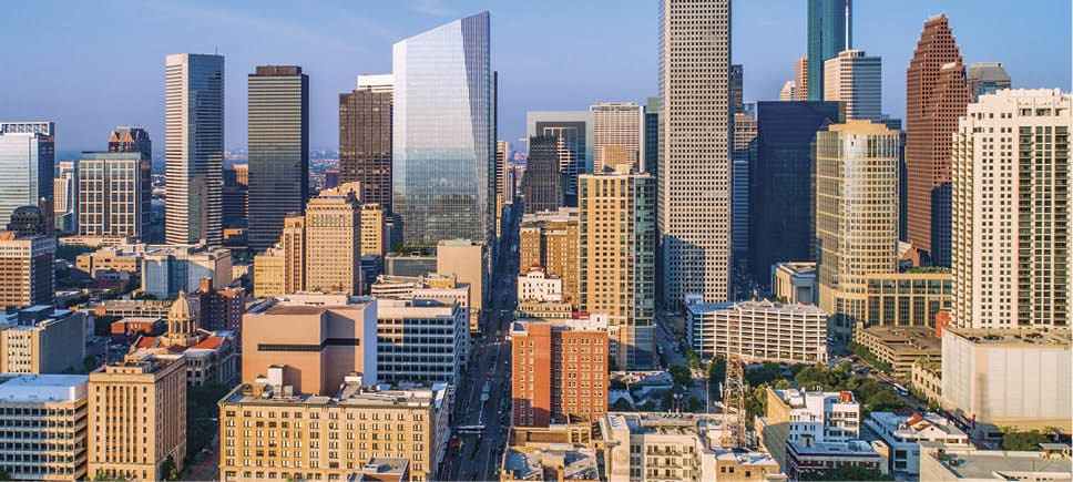 Cyclists casting shadows on indoor track