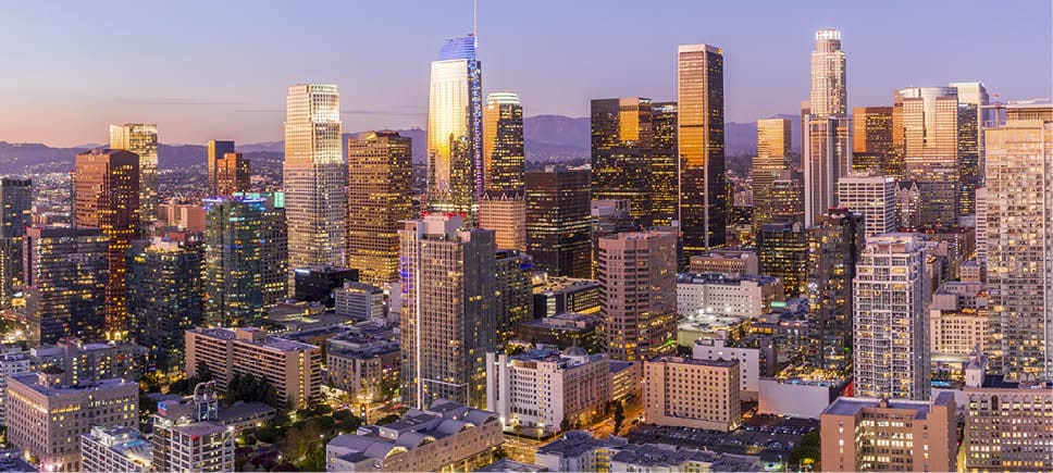 Drone shot of downtown Los Angeles at twilight.