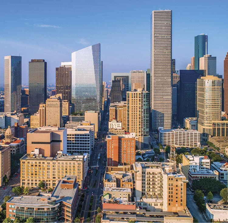 Cyclists casting shadows on indoor track