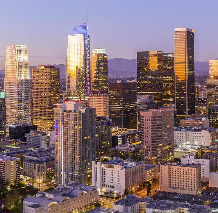 Drone shot of downtown Los Angeles at twilight.
