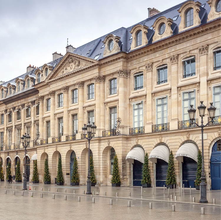 Paris, France - January 3rd, 2016: Exterior of boutique shops at Place Vendome in Paris. Photographed on a winter afternoon.
